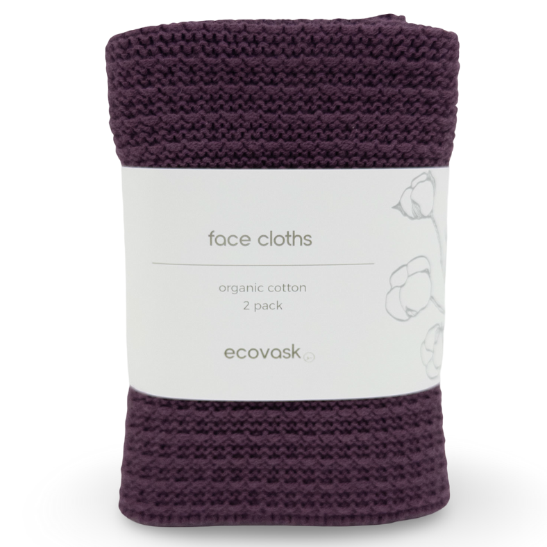 Purple face cloth with a white label on a white background