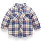 A long-sleeve plaid button-up shirt for a toddler, featuring a cream base with blue and red intersecting plaid lines, two chest pockets, and a pointed collar, shown against a plain white background.