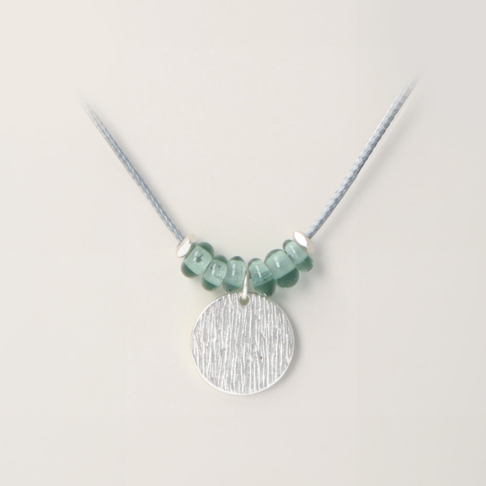Rancho Necklace Silver Textured Disc Teal Glass Beads on Grey Cord
